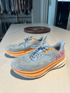 Hoka Women Light Blue Sneakers with Orange and Pink Accents